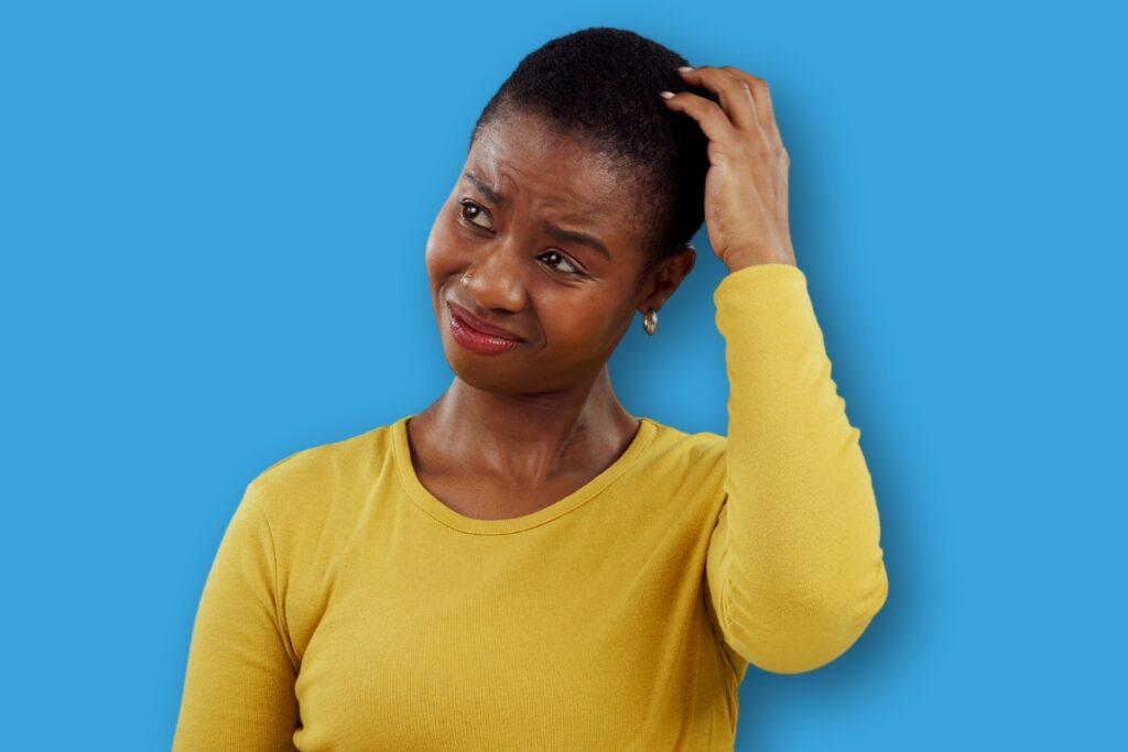 une femme se questionnant au sujet de la rupture conventionnelle